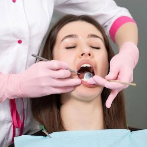 A San Diego oral surgeon explaining the Botox for TMJ procedure to a patient for jaw pain relief.