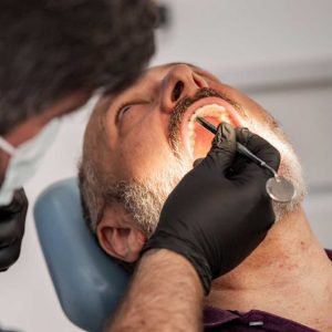 A patient discussing the cost of wisdom teeth removal and tmj treatment san diego options at Elevated Oral Surgery.