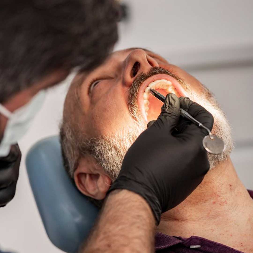 A patient discussing the cost of wisdom teeth removal and tmj treatment san diego options at Elevated Oral Surgery.